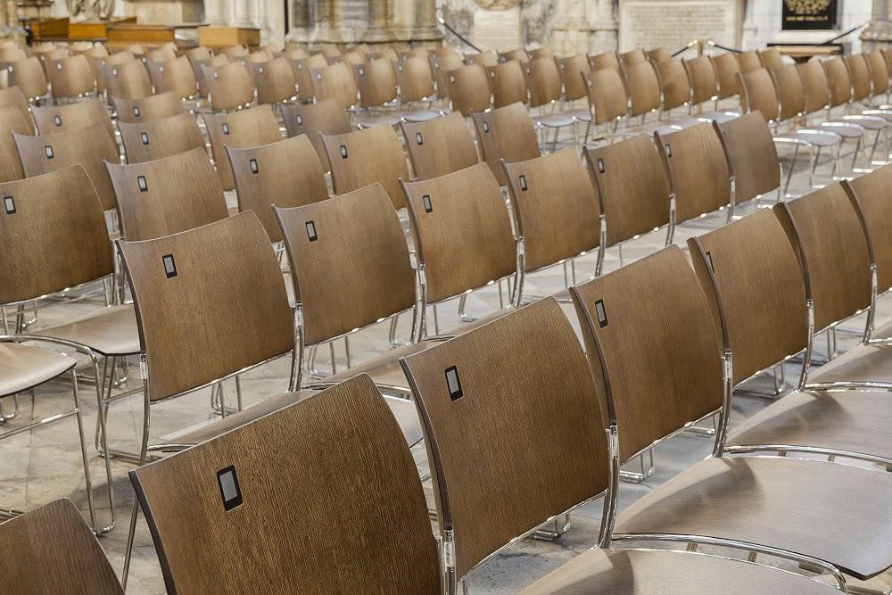 Casala’s smart seating in Westminster Abbey uses batteryless displays to show seat numbers, row numbers or logos